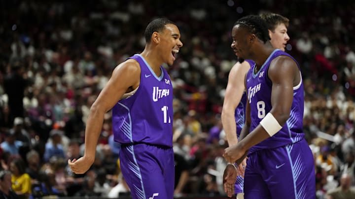 Jul 14, 2025; Las Vegas, NV, USA; Utah Jazz forward John Tonje (17) celebrates with guard Isaiah Collier (8) after scoring against the San Antonio Spurs during the second half of an NBA basketball game at the Thomas Mack Center. Mandatory Credit: Lucas Peltier-Imagn Images