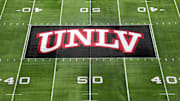 The UNLV Rebels logo at midfield during the Mountain West Championship at Allegiant Stadium. Mandatory Credit: Kirby Lee-Imagn Images