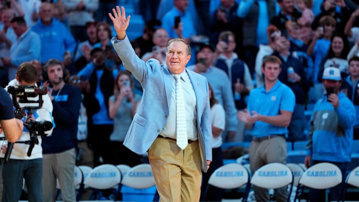 Dec 14, 2024; Chapel Hill, North Carolina, USA; North Carolina Tar Heels head football coach Bill Belichick is introduced during half time at Dean E. Smith Center. Mandatory Credit: Bob Donnan-Imagn Images Dec 14, 2024; Chapel Hill, North Carolina, USA; North Carolina Tar Heels head football coach Bill Belichick is introduced during half time at Dean E. Smith Center. Mandatory Credit: Bob Donnan-Imagn Images