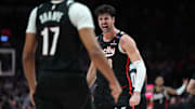Mar 12, 2025; Portland, Oregon, USA; Portland Trail Blazers small forward Deni Avdija (8) celebrates a basket and a foul with guard Shaedon Sharpe (17) during overtime against the New York Knicks at Moda Center. Mandatory Credit: Soobum Im-Imagn Images