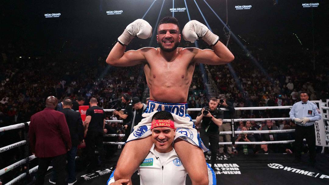 Mar 25, 2023; Las Vegas, Nevada, USA; Jesus Ramos (blue/white trunks) celebrates after defeating Joey Spence (not pictured) in their boxing bout at MGM Grand Garden Arena. Mandatory Credit: Joe Camporeale-USA TODAY Sports