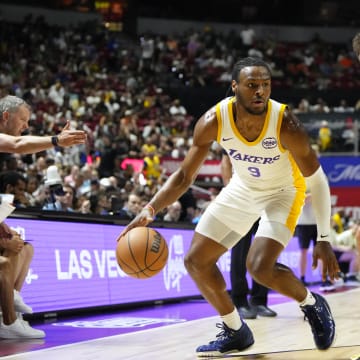 Jul 15, 2024; Las Vegas, NV, USA; Los Angeles Lakers guard Bronny James (9) dribbles the ball against Boston Celtics forward Anton Watson (28) during the first half at Thomas & Mack Center. Mandatory Credit: Lucas Peltier-USA TODAY Sports