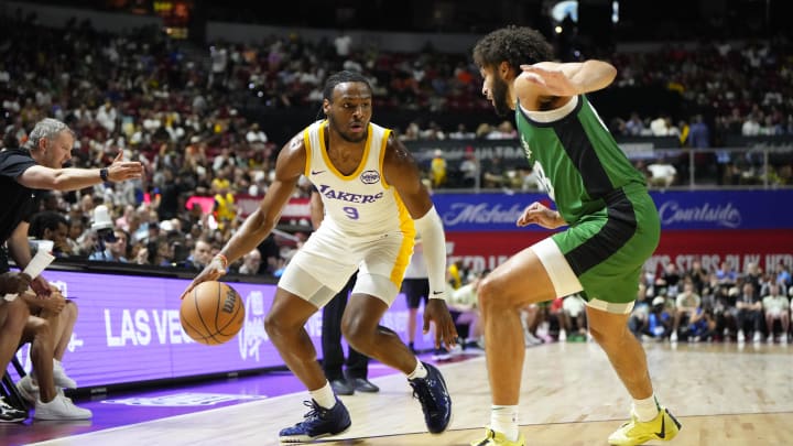 Jul 15, 2024; Las Vegas, NV, USA; Los Angeles Lakers guard Bronny James (9) dribbles the ball against Boston Celtics forward Anton Watson (28) during the first half at Thomas & Mack Center. Mandatory Credit: Lucas Peltier-USA TODAY Sports