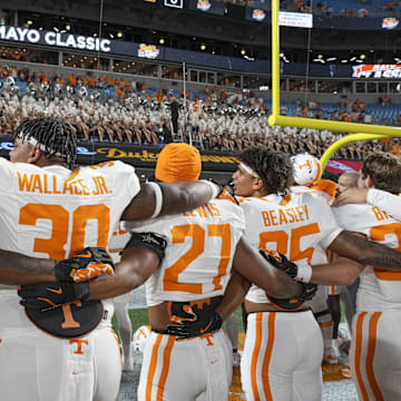 Sep 7, 2024; Charlotte, North Carolina, USA; Tennessee Volunteers celebrate their alma mater with the band after the second half against the North Carolina State Wolfpack at the Dukes Mayo Classic at Bank of America Stadium. Mandatory Credit: Jim Dedmon-Imagn Images
