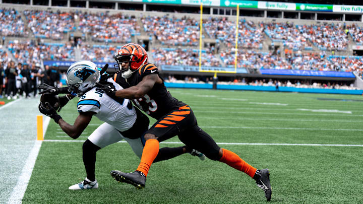 Cincinnati Bengals cornerback Dax Hill (23) breaks up a pass attempt to Carolina Panthers wide receiver Diontae Johnson (5) in the first quarter of the NFL game at Bank of America Stadium in Charlotte, N.C., on Sunday, Sept. 29, 2024.