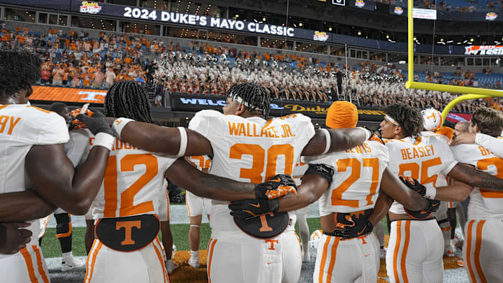 Sep 7, 2024; Charlotte, North Carolina, USA; Tennessee Volunteers celebrate their alma mater with the band after the second half against the North Carolina State Wolfpack at the Dukes Mayo Classic at Bank of America Stadium. Mandatory Credit: Jim Dedmon-Imagn Images Sep 7, 2024; Charlotte, North Carolina, USA; Tennessee Volunteers celebrate their alma mater with the band after the second half against the North Carolina State Wolfpack at the Dukes Mayo Classic at Bank of America Stadium. Mandatory Credit: Jim Dedmon-Imagn Images