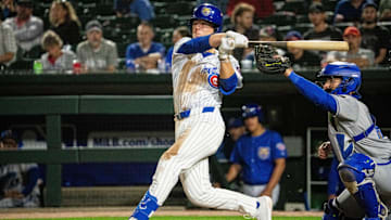 Iowa Cubs' James Triantos (4) swings at the ball on Friday, March 28, 2025, at Principal Park in Des Moines.
