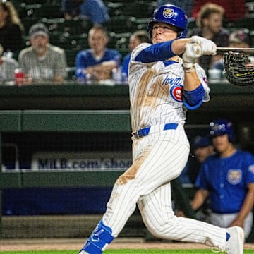 Iowa Cubs' James Triantos (4) swings at the ball on Friday, March 28, 2025, at Principal Park in Des Moines.