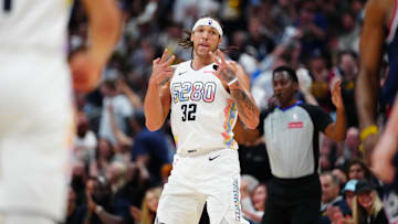 Apr 29, 2025; Denver, Colorado, USA; Denver Nuggets forward Aaron Gordon (32) reacts in the fourth quarter against the LA Clippers during game five of the first round for the 2025 NBA Playoffs at Ball Arena. Mandatory Credit: Ron Chenoy-Imagn Images