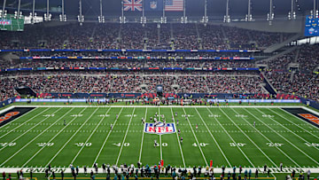 Oct 13, 2024; London, United Kingdom; A general view as Jacksonville Jaguars quarterback Trevor Lawrence (16) prepares to take the snap against the Chicago Bears on the NFL shield logo during an NFL International Series game at Tottenham Hotspur Stadium. Mandatory Credit: Kirby Lee-Imagn Images