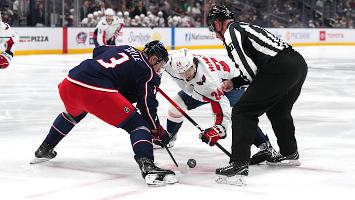 Blue Jackets center Charlie Coyle takes a faceoff against the Washington Capitals.