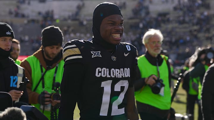 Nov 29, 2024; Boulder, Colorado, USA; Colorado Buffaloes wide receiver Travis Hunter (12) reacts following the win against the Oklahoma State Cowboys at Folsom Field. Mandatory Credit: Ron Chenoy-Imagn Images