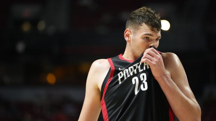 Jul 15, 2024; Las Vegas, NV, USA; Portland Trail Blazers center Donovan Clingan (23) wipes his face with his jersey during the first half against the Philadelphia 76ers at Thomas & Mack Center. Mandatory Credit: Lucas Peltier-USA TODAY Sports