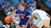 Nov 15, 2024; Chapel Hill, North Carolina, USA; American University Eagles forward Matt Rogers (15) with the ball as North Carolina Tar Heels forward Jalen Washington (13) defends in the first half at Dean E. Smith Center. Mandatory Credit: Bob Donnan-Imagn Images