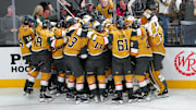 Apr 29, 2025; Las Vegas, Nevada, USA; Vegas Golden Knights players celebrate after the Golden Knights defeated the Minnesota Wild 3-2 in overtime in game five of the first round of the 2025 Stanley Cup Playoffs at T-Mobile Arena. Mandatory Credit: Stephen R. Sylvanie-Imagn Images