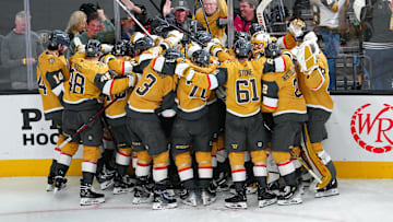 Apr 29, 2025; Las Vegas, Nevada, USA; Vegas Golden Knights players celebrate after the Golden Knights defeated the Minnesota Wild 3-2 in overtime in game five of the first round of the 2025 Stanley Cup Playoffs at T-Mobile Arena. Mandatory Credit: Stephen R. Sylvanie-Imagn Images