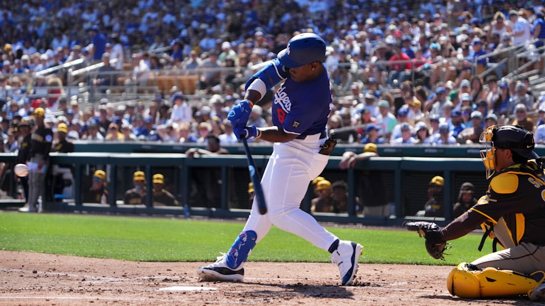 Feb 23, 2025; Phoenix, Arizona, USA; Los Angeles Dodgers right fielder Zyhir Hope (94) hits an RBI against the San Diego Padres during the second inning at Camelback Ranch-Glendale. Mandatory Credit: Joe Camporeale-Imagn Images