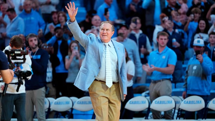 Dec 14, 2024; Chapel Hill, North Carolina, USA; North Carolina Tar Heels head football coach Bill Belichick is introduced during half time at Dean E. Smith Center. Mandatory Credit: Bob Donnan-Imagn Images Dec 14, 2024; Chapel Hill, North Carolina, USA; North Carolina Tar Heels head football coach Bill Belichick is introduced during half time at Dean E. Smith Center. Mandatory Credit: Bob Donnan-Imagn Images