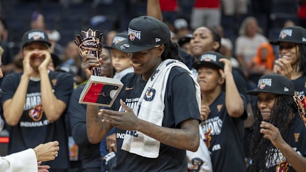 Fever forward Natasha Howard (6) hols up the MVP trophy after defeating the Lynx during the Commissioner's Cup