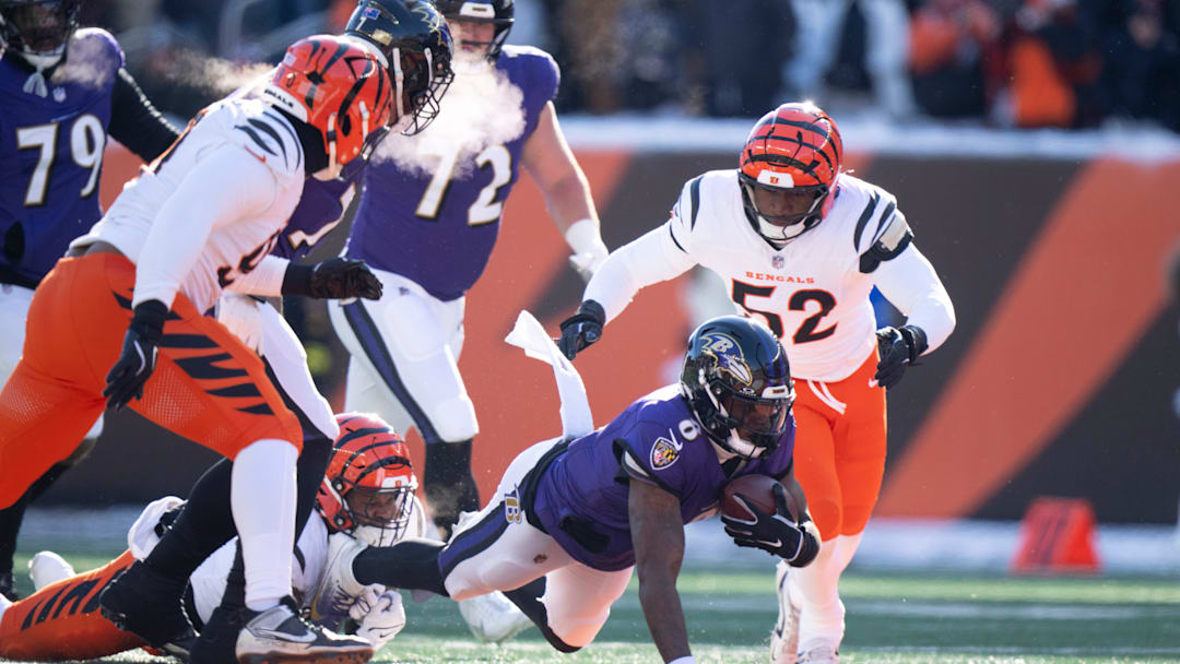 Cincinnati Bengals defensive end Myles Murphy (99) tackles Baltimore Ravens quarterback Lamar Jackson (8) in the first quarter of the NFL football game at Paycor Stadium in Cincinnati on Dec. 14, 2025.