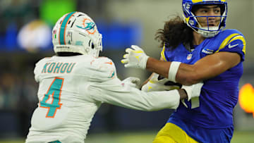 Nov 11, 2024; Inglewood, California, USA; Los Angeles Rams wide receiver Puka Nacua (17) carries the ball against Miami Dolphins cornerback Kader Kohou (4) in the second half at SoFi Stadium. Mandatory Credit: Kirby Lee-Imagn Images