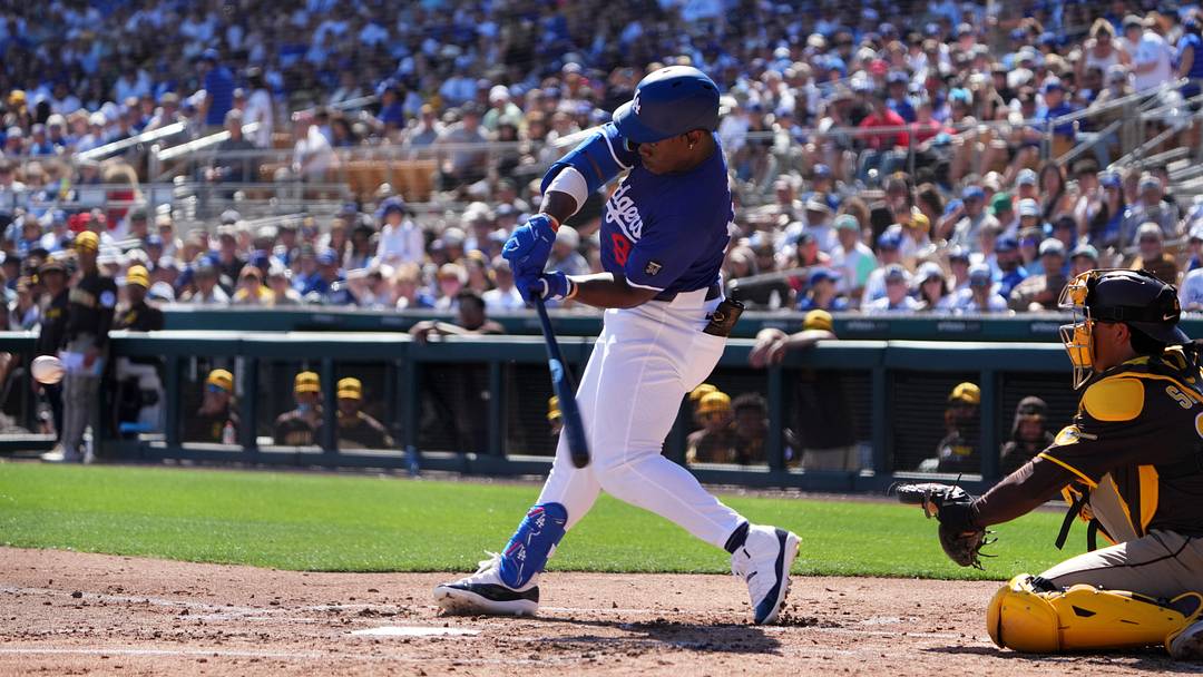 Feb 23, 2025; Phoenix, Arizona, USA; Los Angeles Dodgers right fielder Zyhir Hope (94) hits an RBI against the San Diego Padres during the second inning at Camelback Ranch-Glendale. Mandatory Credit: Joe Camporeale-Imagn Images