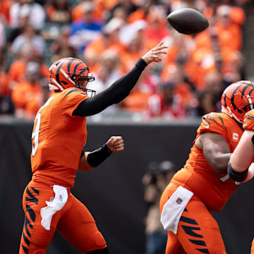 Cincinnati Bengals quarterback Joe Burrow (9) throws a pass as New England Patriots defensive tackle Trysten Hill (97) attempts to deflect it in the first quarter of the NFL game at Paycor Stadium in Cincinnati on Sunday, Sept. 8, 2024.