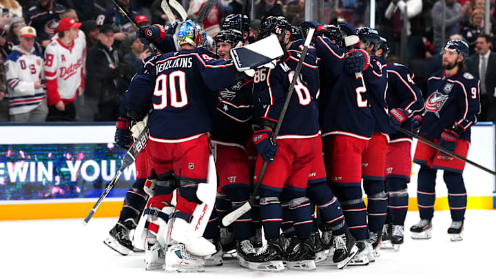The Columbus Blue Jackets celebrate their win over the Detroit Red Wings on Thursday night. 