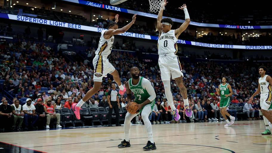 Boston Celtics guard Jaylen Brown pump fakes New Orleans Pelicans forward Trey Murphy III and guard Jeremiah Fears.