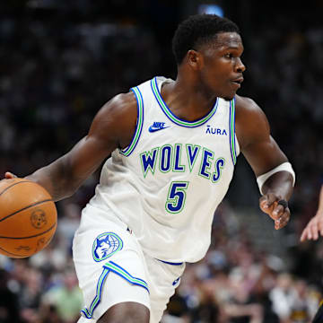 May 19, 2024; Denver, Colorado, USA; Minnesota Timberwolves guard Anthony Edwards (5) drives at the basket in the first quarter against the Denver Nuggets in game seven of the second round for the 2024 NBA playoffs at Ball Arena.