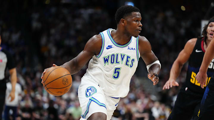 May 19, 2024; Denver, Colorado, USA; Minnesota Timberwolves guard Anthony Edwards (5) drives at the basket in the first quarter against the Denver Nuggets in game seven of the second round for the 2024 NBA playoffs at Ball Arena.