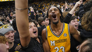 Dec 8, 2024; Columbia, Missouri, USA; Missouri Tigers guard Aidan Shaw (23) celebrates with fans after defeating the Kansas Jayhawks at Mizzou Arena. Mandatory Credit: Jay Biggerstaff-Imagn Images