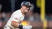San Francisco Giants catcher Andrew Knizner (21) celebrates after hitting a RBI triple against the St. Louis Cardinals during the eighth inning at Oracle Park. 