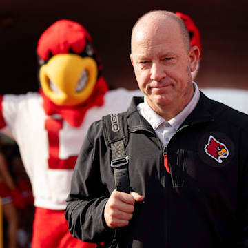 Louisville Cardinals head coach Jeff Brohm walks through the card march ahead of their game on Saturday, Aug. 31, 2024 at L&N Federal Credit Union Stadium in Louisville, Ky.