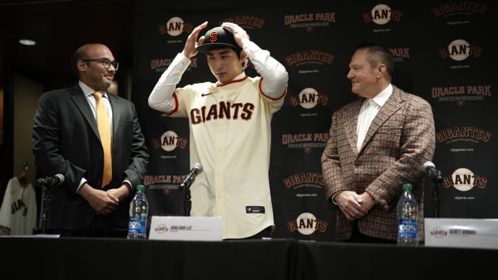 Super Agent Scott Boras, far right, is getting some payback for his high demands on top free agents this winter. He is pictured here on the far right as the San Francisco Giants Introduce Jung Hoo Lee.