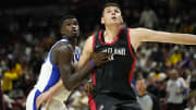 Jul 15, 2024; Las Vegas, NV, USA; Portland Trail Blazers center Donovan Clingan (23) competes against Philadelphia 76ers forward/center Adem Bona (30) during the second half at Thomas & Mack Center. Mandatory Credit: Lucas Peltier-USA TODAY Sports