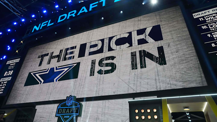 The Dallas Cowboys logo is projected on the video board during the NFL Draft at Lambeau Field. The Dallas Cowboys logo is projected on the video board during the NFL Draft at Lambeau Field.
