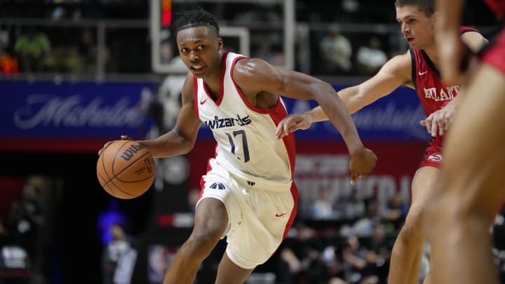 Jul 12, 2024; Las Vegas, NV, USA;  Washington Wizards guard Bub Carrington (17) drives the ball against Atlanta Hawks guard Nikola Durisic (7) during the second half at Thomas & Mack Center. Mandatory Credit: Lucas Peltier-USA TODAY Sports