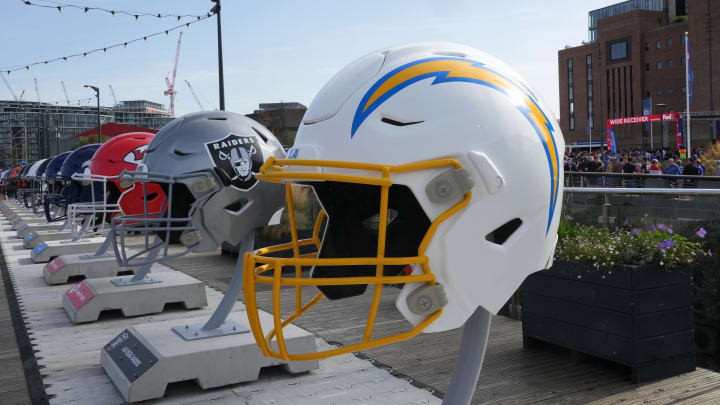 Oct 7, 2023; London, United Kingdom; Large oversized helmets of the Los Angeles Chargers, Las Vegas Raiders and Kansas City Chiefs at the NFL Experience London at the Battersea Power Station. Mandatory Credit: Kirby Lee-USA TODAY Sports