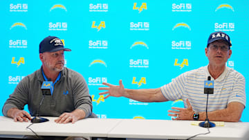 Jan 15, 2025; El Segundo, CA, USA; Los Angeles Chargers general manager Joe Hortiz (left) and coach Jim Harbaugh.