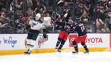 Adam Fantilli celebrates a goal with Dmitri Voronkov. 