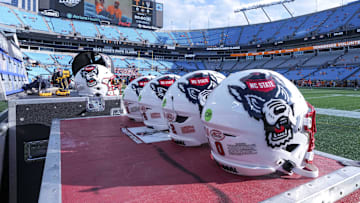 Sep 7, 2024; Charlotte, North Carolina, USA; North Carolina State Wolfpack helmets during pregame activity for the Dukes Mayo Classic against the Tennessee Volunteers at Bank of America Stadium. Mandatory Credit: Jim Dedmon-Imagn Images