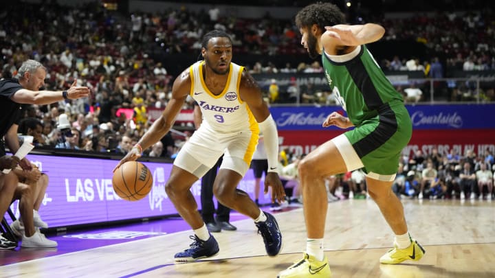 Jul 15, 2024; Las Vegas, NV, USA; Los Angeles Lakers guard Bronny James (9) dribbles the ball against Boston Celtics forward Anton Watson (28) during the first half at Thomas & Mack Center. Mandatory Credit: Lucas Peltier-USA TODAY Sports