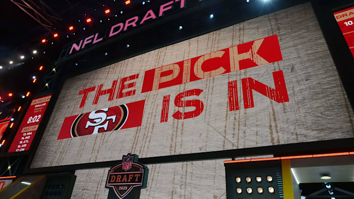 The San Francisco 49ers logo is projected on the video board during the NFL Draft