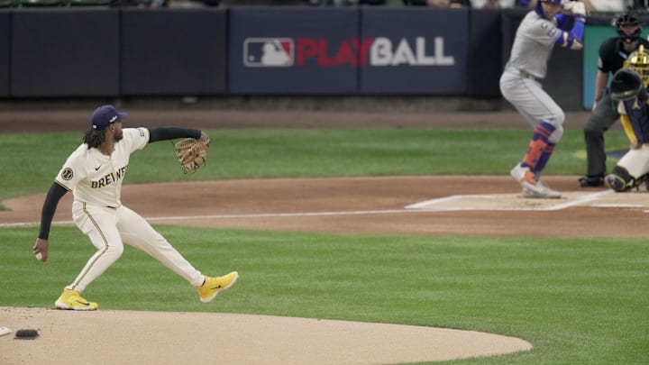 Oct 1, 2024; Milwaukee, Wisconsin, USA; Milwaukee Brewers pitcher Freddy Peralta (51) pitches against New York Mets outfielder Brandon Nimmo (9) during the first inning during the first inning in game game one of the Wildcard round for the 2024 MLB Playoffs against the New York Mets at American Family Field. Mandatory Credit: Mark Hoffman/USA TODAY Network via Imagn Images