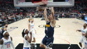 Oct 19, 2023; Los Angeles, California, USA; Denver Nuggets forward Hunter Tyson (4) dunks the ball against the LA Clippers in the first half at Crypto.com Arena. 