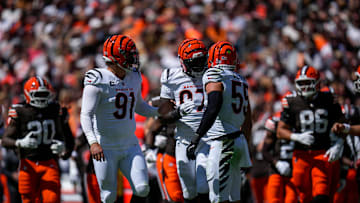 Cincinnati Bengals defensive end Trey Hendrickson (91), defensive end Shemar Stewart (97) and linebacker Logan Wilson (55) talk before coming off the field on fourth down in the second quarter of the NFL Week 1 game between the Cleveland Browns and the Cincinnati Bengals at Huntington Bank Field in Cleveland on Sunday, Sept. 7, 2025.