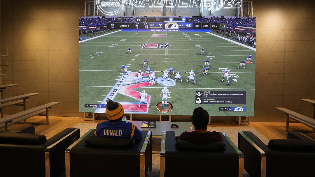 People play EA Sports Madden 22 video game at the Nike store at the Grove.