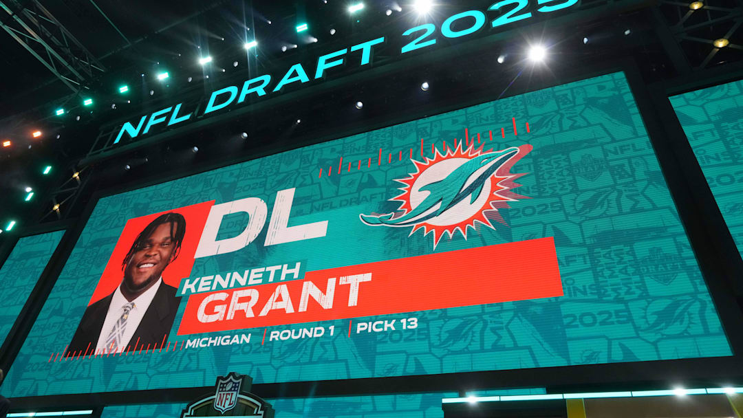 Michigan Wolverines defensive lineman Kenneth Grant is selected as the No. 13 pick by the Miami Dolphins during the NFL Draft at Lambeau Field.