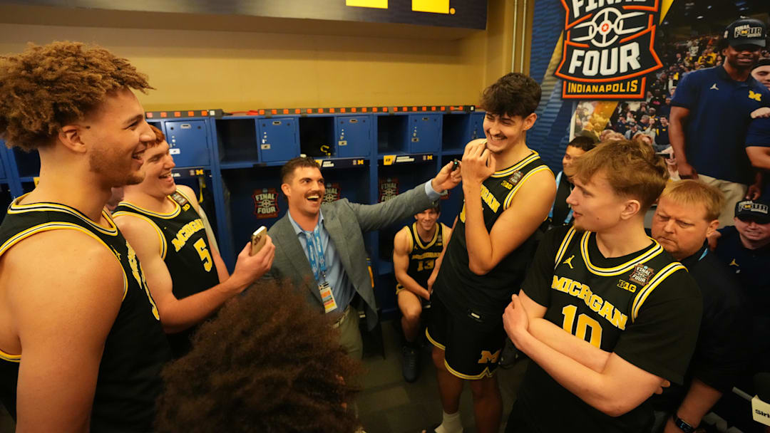 Michigan Wolverines center Malick Kordel, forward Oscar Goodman, center Aday Mara, and guard Winters Grady react during open locker room ahead of the Final Four of the men's 2026 NCAA Tournament 